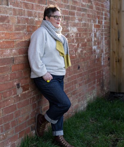 Woman wearing the Duchess Jeans sewing pattern from Sew Me Something on The Fold Line. A trouser pattern made in denim, corduroy or linen fabrics, featuring a straight cut, turned up hems, slight relaxed fit, belt loops, five-pockets and five-button fly.