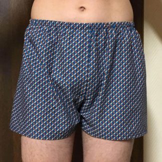 Man wearing the Men's Classic Boxer Shorts sewing pattern from Wardrobe by Me on The Fold Line. A boxer shorts pattern made in lightweight woven fabrics, featuring a non-functional decorative front fly, elasticated waist and relaxed fit.