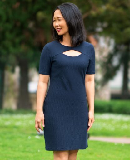 Woman wearing the Brisbane Dress sewing pattern from Itch to Stitch on The Fold Line. A dress pattern made in jersey, interlock, viscose or French terry fabrics, featuring a semi-fit, front keyhole detail, above knee length hem and short sleeves.