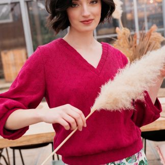 Woman wearing the Charlie Sweater sewing pattern from Atelier Jupe on The Fold Line. A jumper dress pattern made in sweatshirting, French terry or knitted fabrics, featuring a V-neckline and three-quarter length gathered sleeve.
