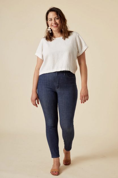 Woman wearing the Ginger Jeans sewing pattern from Closet Core Patterns on The Fold Line. A jeans pattern made in stretch denim, twill or corduroy fabrics, featuring a high rise, skinny leg, slim fit, front and back pockets and fly zip front closure.