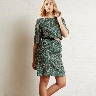 Woman wearing the Pippa Dress sewing pattern from Atelier Jupe on The Fold Line. A dress pattern made in viscose or tencel fabrics, featuring a loose, straight fit, boat neckline, wide half-length sleeves and purchased belt.