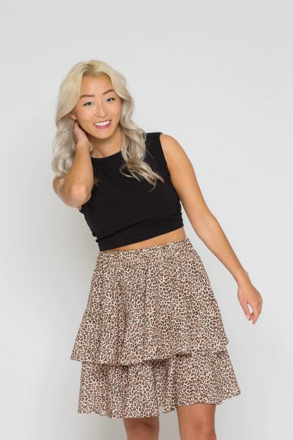 Woman wearing the Alice Skirt sewing pattern from Bara Studio on The Fold Line. A mini skirt pattern made in viscose, cotton, linen or tencel fabrics, featuring two tiers and elasticated waist.