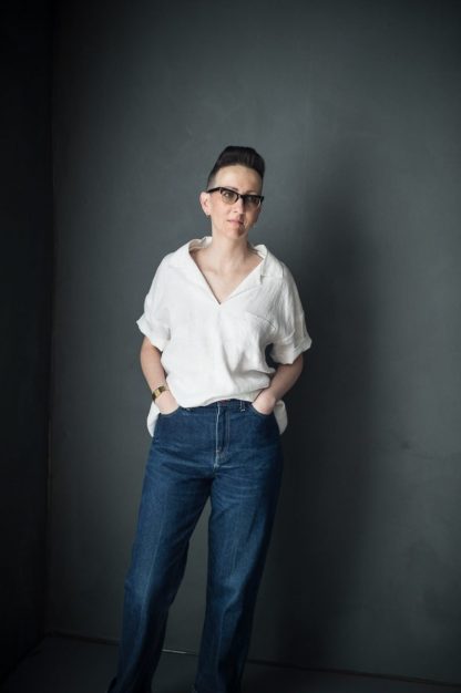 Woman wearing The Factory Top sewing pattern from Merchant & Mills on The Fold Line. A top pattern made in linen, cotton drill, lightweight denims, fine wool or corduroy fabrics, featuring pattern pieces to make a top with a centre vent.