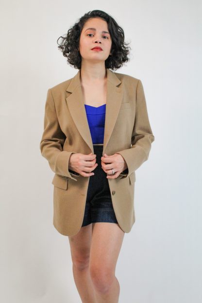Women wearing the Fran Blazer sewing pattern from Bella Loves Patterns on The Fold Line. A blazer pattern made in wool flannels, wool mohair, synthetic wool suiting or gabardine fabrics, featuring a masculine-style, straight oversized silhouette, single-breasted, two-button closure, wide shoulders, shoulder pads, notched collar, 2 pockets with pocket flap and back vent.