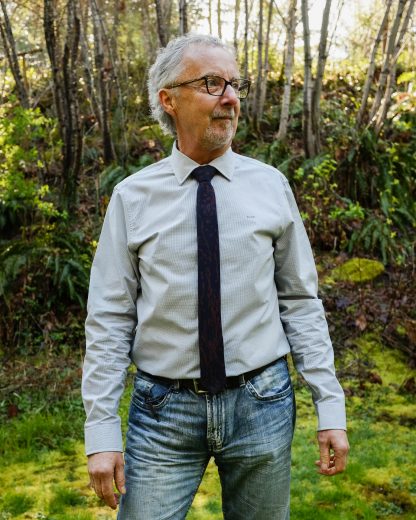 Man wearing the Mahle Tie sewing pattern from Thread Theory on The Fold Line. A tie pattern made in silk, rayon, linen, lightweight cotton or wool fabrics, featuring a bias cut with length and width options.