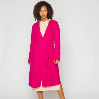 Woman wearing the Terry Coat sewing pattern from Bara Studio on The Fold Line. A wrap coat or duster pattern made in wool, cotton or blends fabrics, featuring a back yoke, collar and lapels, midi length and self-fabric tie belt.
