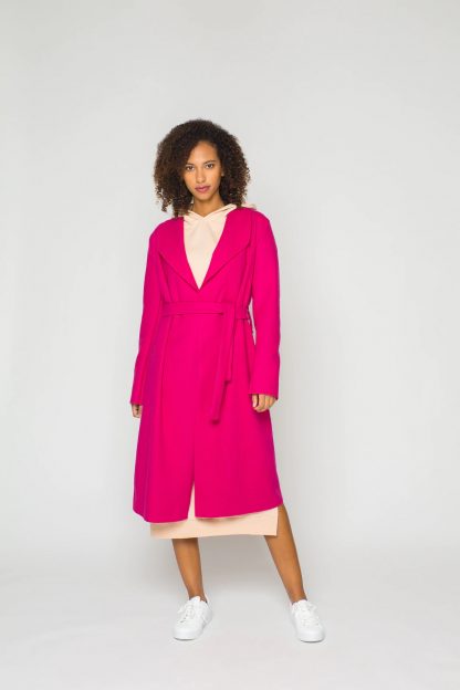 Woman wearing the Terry Coat sewing pattern from Bara Studio on The Fold Line. A wrap coat or duster pattern made in wool, cotton or blends fabrics, featuring a back yoke, collar and lapels, midi length and self-fabric tie belt.