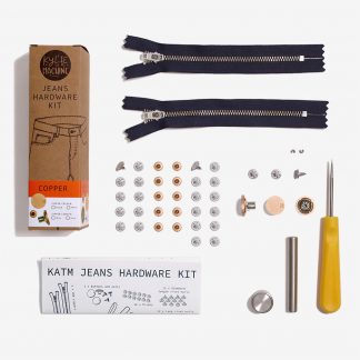 Photo showing the Jeans Hardware Kit from Kylie & The Machine on The Fold Line. The kit includes hardware for 2 pairs of jeans. 2 x YKK locking jeans zippers (15 cm long with a nickel finish), 2 x zipper "top stops" for use in shortening the zipper, 3 x jeans buttons and nails, 12 x rivets and standard nails, 12 x longer rivet nails, 1 x reusable tool kit including a 3 mm awl, circular anvil, rivet setter and button setter, available in copper, matte black, matte gold or pewter finishes.