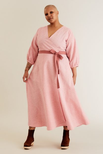 Women wearing the Hali Wrap Dress sewing pattern Named on The Fold Line. A dress pattern made in cotton, linen, Tencel and rayon shirtings or dress-weight fabrics, featuring a semi-fitted wrap bodice, front V-neck, back yoke, wrap tie closure, side pockets, ankle-length circle skirt, 3/4-sleeves with gathered sleeve openings.