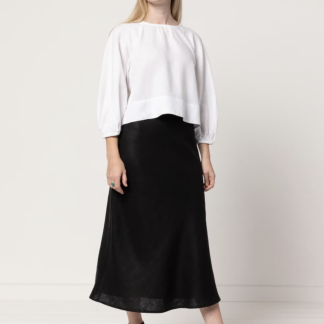 Woman wearing the Genoa Bias Cut Skirt sewing pattern from Style Arc on The Fold Line. A skirt pattern made in linen, cotton or silk fabrics, featuring a pull-on style, ankle-length and elasticated waist.