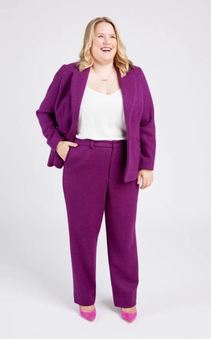 Woman wearing the Meriam Trousers sewing pattern from Cashmerette on The Fold Line. A Trouser pattern made in wool suiting, linen, poly/cotton or poly/wool blend fabrics, featuring a zip fly with hidden closure, front slash pockets, straight legs, back welt pockets and flex waistband that expands by 3-4″.