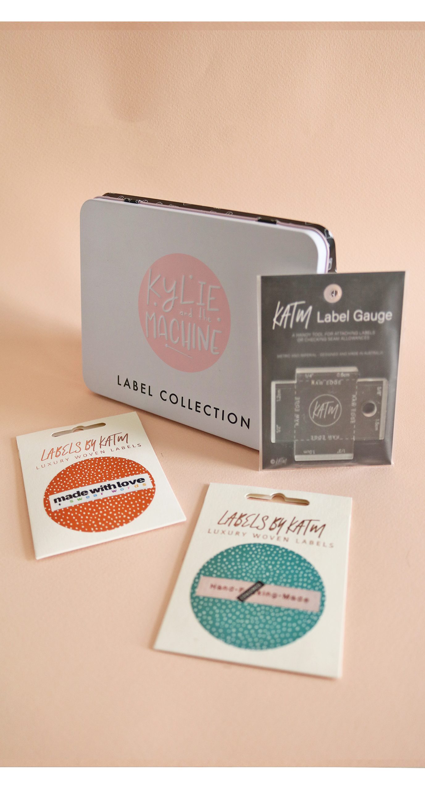 Photo showing the Gift Set Sweary Bundle from Kylie & The Machine on The Fold Line. Kylie & The Machine make beautiful labels to sew into your handmade clothes. This bundle includes two sets of labels (Hand fucking Made and Made with Love and Swear Words), collectors tin and label gauge, making it the perfect gift or present.
