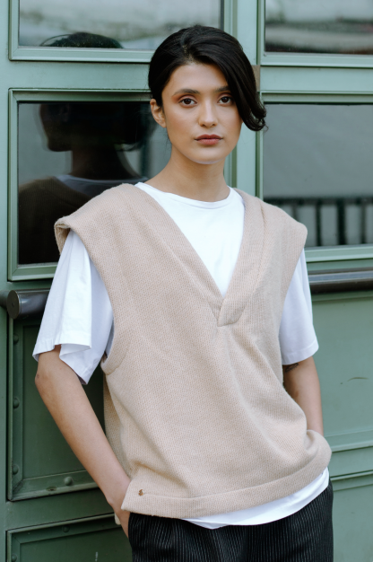 Woman wearing the Basic Slipover sewing pattern from JULIANA MARTEJEVS on The Fold Line. A tank top pattern made in French terry or knit fabrics, featuring a deep V-neck, oversized silhouette, deep arm scythes, and side slits.