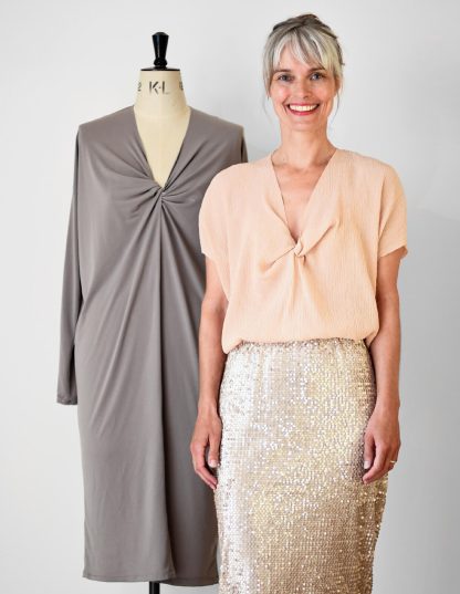 Woman wearing the Origami Dress and Top sewing pattern from The Maker's Atelier on The Fold Line. A blouse pattern made in jersey fabrics, featuring a V-neck with asymmetric twist, drop shoulder creating a batwing effect, short sleeves, and relaxed fit.
