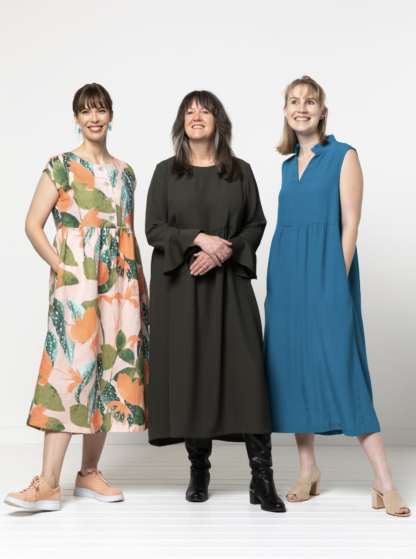 Women wearing the Montana Dress sewing pattern from Style Arc on The Fold Line. A dress pattern made in washed linen, cotton, crepe, or rayon fabrics, featuring pattern pieces to add sleeveless, ¾ or elbow length sleeves, and boat, V-neck or frilled stand collar neck styles.