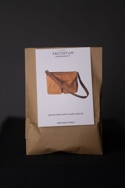Photo showing the Factotum Bag from Merchant & Mills on The Fold Line. The kit includes hardware for the bag; 2 x 1″ loops, 4 x 9 mm rivets, 1 x 30 cm ecru and nickel zip, 1 x 1″ split cowhide leather strap. The metal finish is in Nickel.