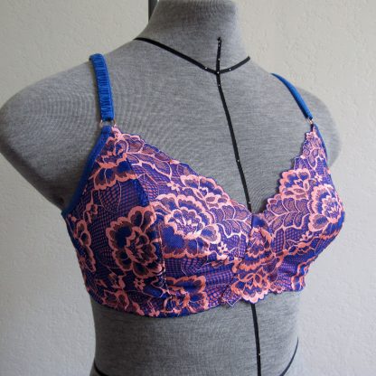 Mannequin wearing the Annika Wireless Bra sewing pattern from Primrose Dawn on The Fold Line. A bra pattern made in duoplex, dazzle tricot, stabilised tricot, sheer cup lining, bra tulle, scuba knit, one-way stretch satin spandex, or 40D tricot fabrics, featuring full-coverage, vertical cup and inner cup dart, back hook and eye closure, scalloped lace edges at neckline, bridge and back band plus adjustable shoulder straps.