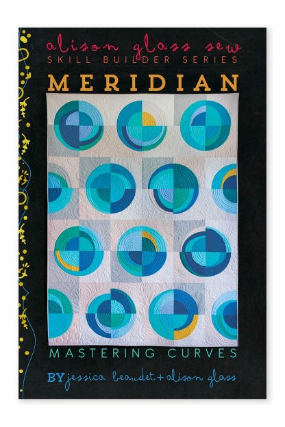 Photo showing the Meridian Quilt sewing pattern from Alison Glass on The Fold Line. A quilt pattern made in quilting cotton fabrics, featuring a design of both round and elliptical curves.