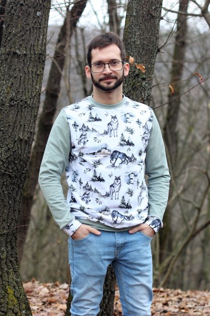 Man wearing the Men's Hot Coffee Sweatshirt sewing pattern from Waves & Wild on The Fold Line. A sweatshirt pattern made in knit fabrics, featuring a relaxed straight fit, crew neck, full length sleeves, plus hem and sleeve bands.