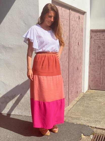 Woman wearing the Mexicana Skirt sewing pattern from You Made My Day on The Fold Line. A skirt pattern made in cotton, Tencel, viscose, silk or gauze fabrics, featuring a midi length, three tiers, relaxed fit and elasticated waist.