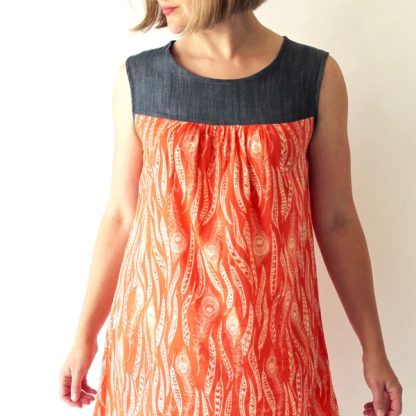 Woman wearing the Ruby Dress and Top sewing pattern from Made by Rae on The Fold Line. A pullover, sleeveless dress and top pattern made in linen or rayon challis fabric, featuring a contrast yoke with gathers, round neck, and above knee or hip length finish.