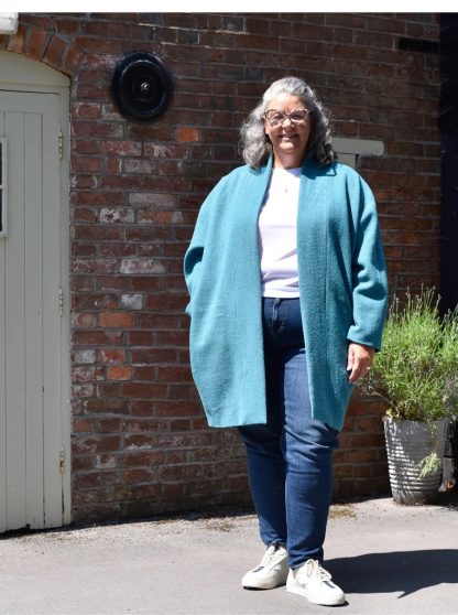 Women wearing the Wimborne Coat sewing pattern from The Avid Seamstress on The Fold Line. A coat pattern made in light to heavy weight woven fabrics, featuring dropped shoulders, fully lined, cocoon shape, in-seam pockets, no closures and extended collar.