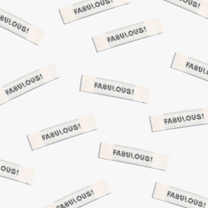 Photo showing 'Fabulous' Labels from Kylie & The Machine on The Fold Line. A washable, durable, and non-scratchy label. Included are, 6 woven labels with black lettering on a cream background. They are all ready to be sewn into your handmade clothes.