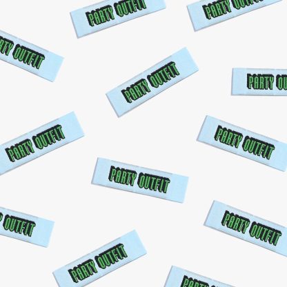 Photo showing 'Party Outfit' Labels from Kylie & The Machine on The Fold Line. A washable, durable, and non-scratchy label. Included are, 6 woven labels with green writing on a pale blue background. They are all ready to be sewn into your handmade clothes.