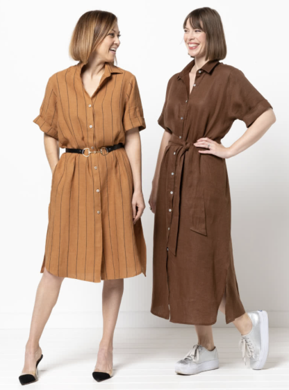 Women wearing the Palmer Woven Dress sewing pattern from Style Arc on The Fold Line. A shirt dress pattern made in linen, cotton, rayon or crepe fabrics, featuring a collar with stand, dropped shoulders, button front closure, short sleeves with folded cuff, in-seam pockets, side splits, shaped hemline, knee or midi length hem, and tie belt.