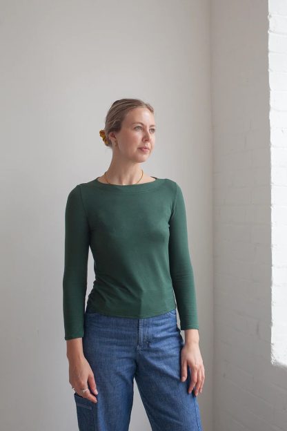 Woman wearing the Boatneck Top sewing pattern from The Modern Sewing Co. on The Fold Line. A top pattern made in cotton jersey, bamboo jersey, modal knit, waffle jersey, and pointelle jersey fabrics, featuring a boatneck, long sleeves and hip length.