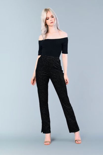 Woman wearing the Highball Pant sewing pattern from Our Lady of Leisure on The Fold Line. A cigarette trouser pattern made in ponte, scuba knit or double jersey fabrics, featuring a high waist, elastic waistband and ankle slits.