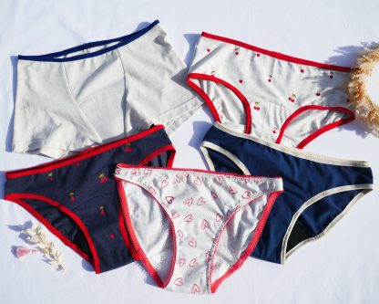 Photo showing the Child/Teen Muun Period Underwear sewing pattern from Petits D'om on The Fold Line. A underwear pattern made in jersey with at least 40% stretch fabrics, featuring a choice of briefs, hipsters or boyshorts, classic or high-cut leg options, and fold-over elastic or picot edge.