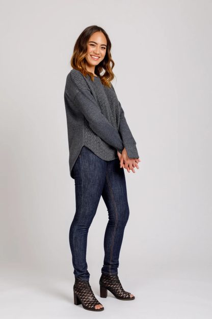 Woman wearing the Jarrah Sweater sewing pattern from Megan Nielsen on The Fold Line. A jumper pattern made in sweatshirt fleece, French terry and sweater knit fabrics, featuring a loose fit, dropped shoulders, crew neck, and long sleeves.