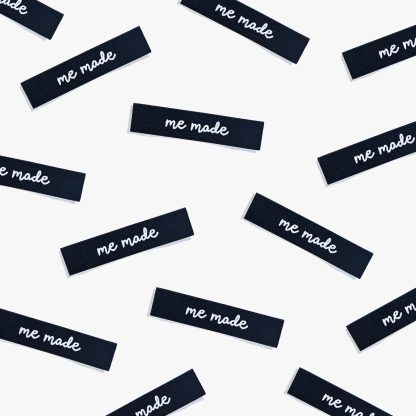 Photo showing 'Me Made' Woven Labels from Kylie & The Machine on The Fold Line. A washable, durable and non-scratchy fabric label featuring the words 'Me Made' all ready to be sewn into your handmade clothes.