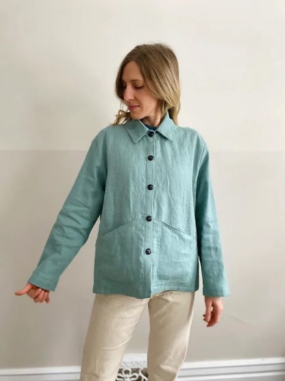 Woman wearing the Portmanteau Shacket sewing pattern from French Navy on The Fold Line. A shacket pattern made in flannel, linen, chambray, denim, corduroy, wool, or wool blends fabrics, featuring a relaxed boxy fit, slightly dropped shoulders, two-piece collar, separate button stand, angled hip pockets, and full-length sleeves.