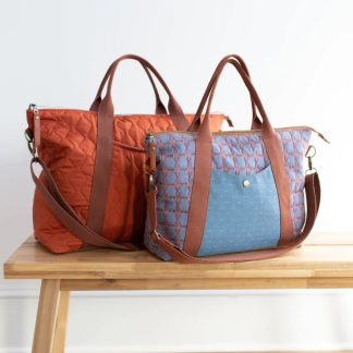 Photo showing the Oxbow Totes sewing pattern from Noodlehead on The Fold Line. A bag pattern made in dry oilskin/waxed or twill/waxed canvas fabrics, featuring a zip closure, two sizes, front pocket, reinforced base, removable crossbody strap, and roomy interior with slip pocket.