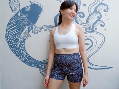 Teen wearing the Teen Girls’ Callisto Leggings sewing pattern from Waves & Wild on The Fold Line. A leggings pattern made in 4-way stretch knit fabric, featuring a wide waistband and shorts length.