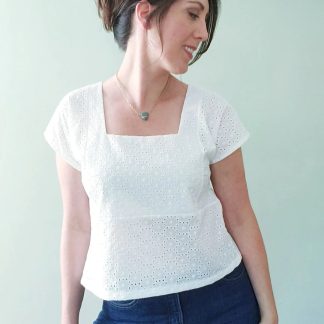 Woman wearing the Fern Top Expansion Pack sewing pattern from Pattern Scout on The Fold Line. A top pattern made in linen, chambray, poplin, voile, tencel, rayon challis, or crepe de chine fabric, featuring a boxy fit, square neck, and grown-on short sleeves.