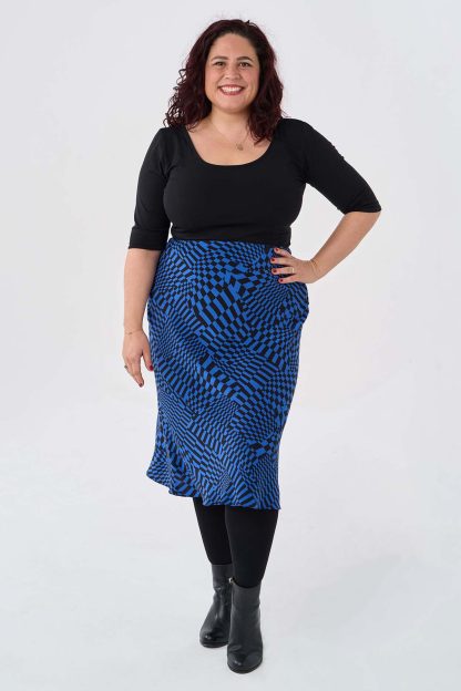 Woman wearing the Selena Skirt sewing pattern from Sew Over It on The Fold Line. A skirt pattern made in crepe or satin fabric, featuring a bias cut and elastic waist.