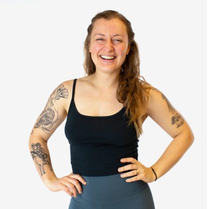 Woman wearing the Slocan Tank sewing pattern from Helen’s Closet on The Fold Line. A tank top pattern made in bamboo jersey, modal jersey, or stretchy athletic knit fabric, featuring a snug fit, shoulder straps, and a knit binding finish.